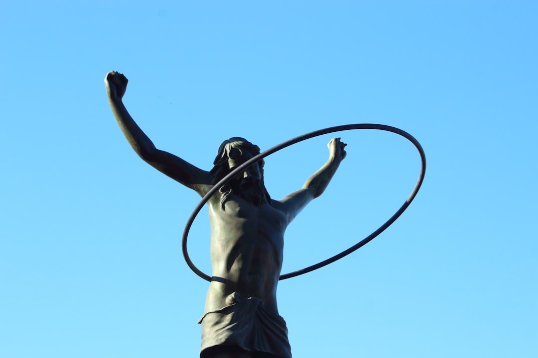 a-statue-of-a-man-holding-a-hula-hoop-6mjgnfkrxjs